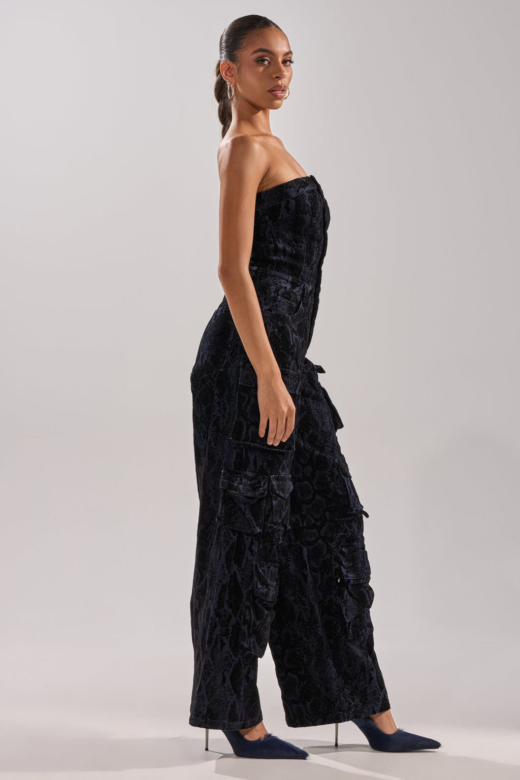 CAUGHT YOUR EYE VELVET DENIM JUMPSUIT IN SNAKEPRINT