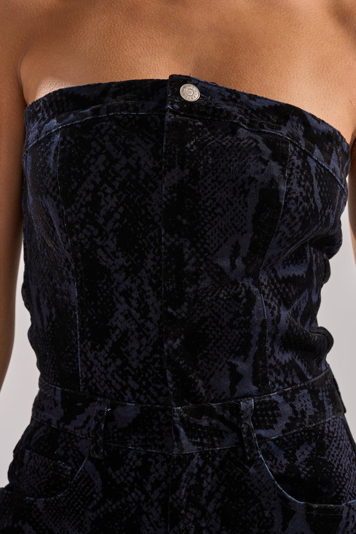 CAUGHT YOUR EYE VELVET DENIM JUMPSUIT IN SNAKEPRINT